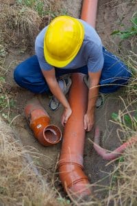 Man fixing Septic System Service Port Charlotte
